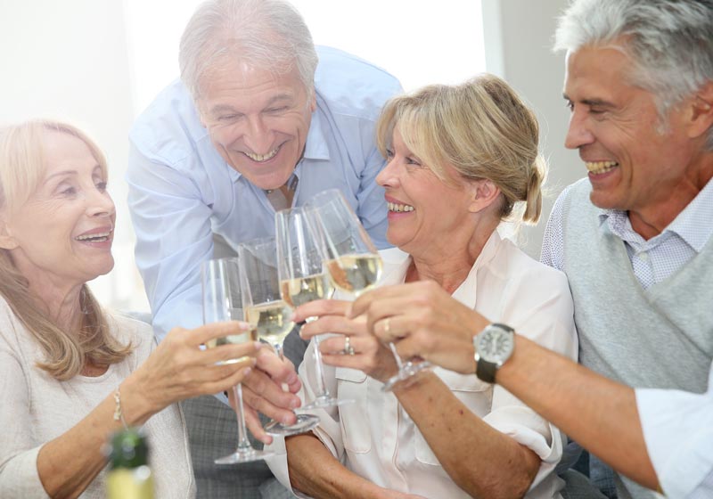 seniors toasting at Encore Luxury Living