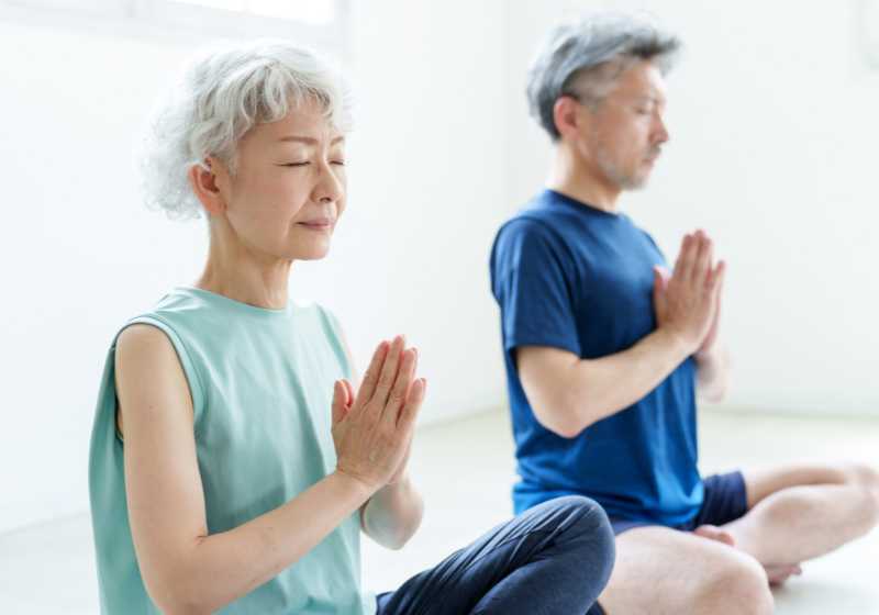 meditation senior couple practicing meditation